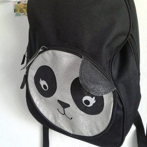 Previously owned canvas Panda back pack.